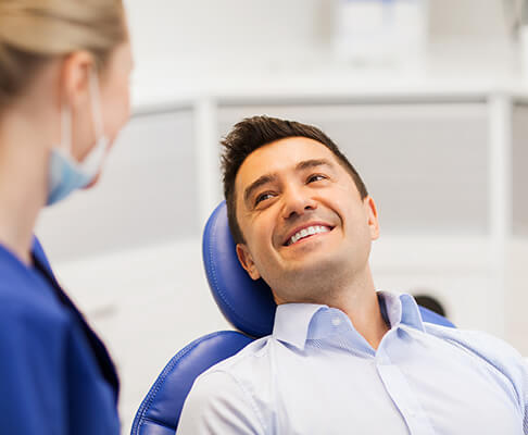 Man smiling at the dentist